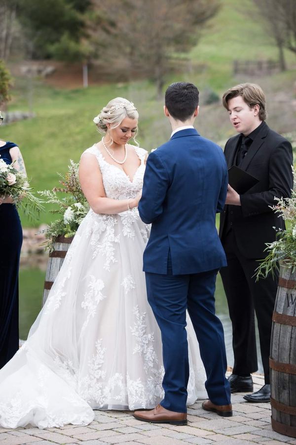 Reed officiating a wedding ceremony